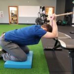 kneeling lat pose